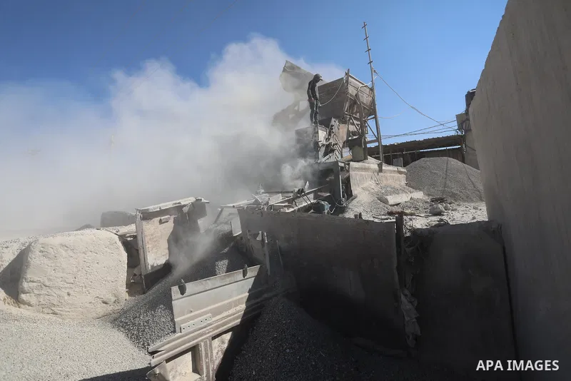 Palestinian workers crush stones and cement blocks from houses destroyed during the recent war on Gaza strip, in Gaza city on June 27, 2021. Owners of houses partially or totally destroyed during the recent war on Gaza a...