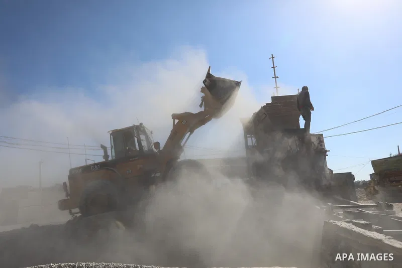 Palestinian workers crush stones and cement blocks from houses destroyed during the recent war on Gaza strip, in Gaza city on June 27, 2021. Owners of houses partially or totally destroyed during the recent war on Gaza a...