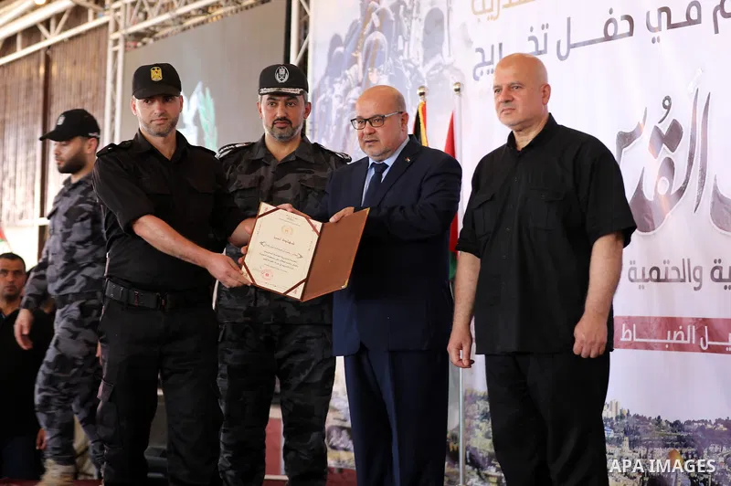 The head of government administration in Gaza Strip, Essam Al-Dalis attend Palestinian police officers graduation ceremony organized by the General Directorate of Training in the Palestinian Police, in Gaza city on June...