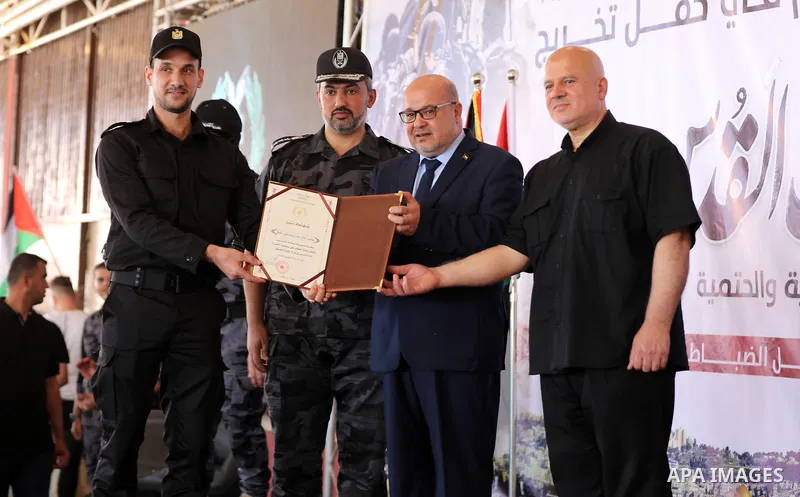 The head of government administration in Gaza Strip, Essam Al-Dalis attend Palestinian police officers graduation ceremony organized by the General Directorate of Training in the Palestinian Police, in Gaza city on June...