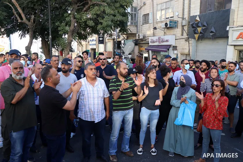 Palestinians take part during a protest aganist the death of human rights activist Nizar Banat in the West Bank city of Ramallah, on June 27, 2021. Photo by Ibrahim atta