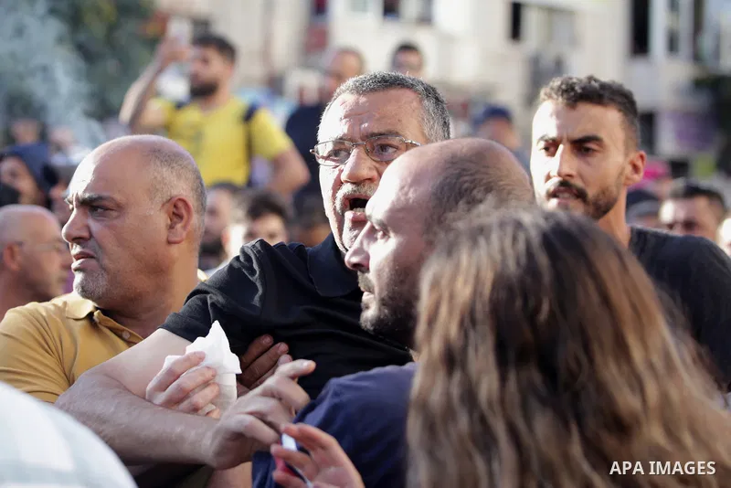 Palestinians take part during a protest aganist the death of human rights activist Nizar Banat in the West Bank city of Ramallah, on June 27, 2021. Photo by Ibrahim atta