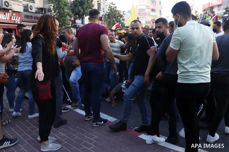 Palestinians take part during a protest aganist the death of human rights activist Nizar Banat in the West Bank city of Ramallah, on June 27, 2021. Photo by Ibrahim atta