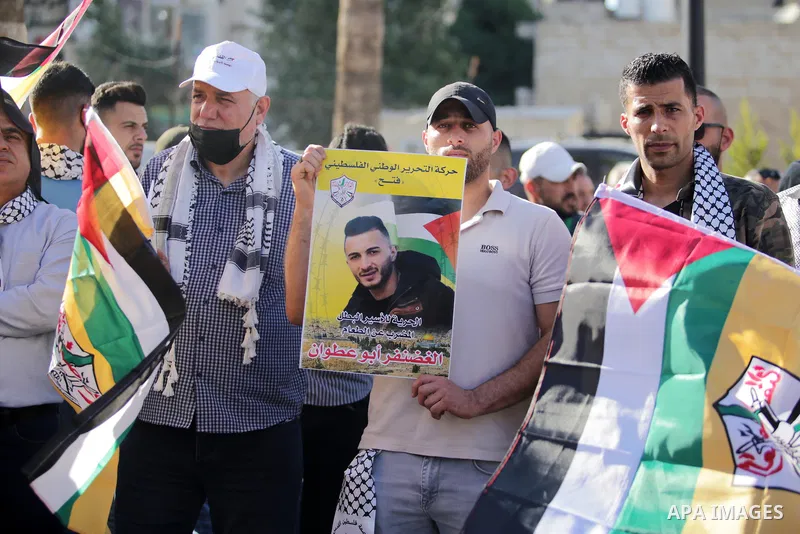 Protesters take part in a protest in solidarity with Palestinian prisoner on hunger strike in Israeli jails, Ghadanfar Abu Utwan, in the West Bank city of Ramallah, on June 27, 2021. Abu Utwan has been on hunger strike f...