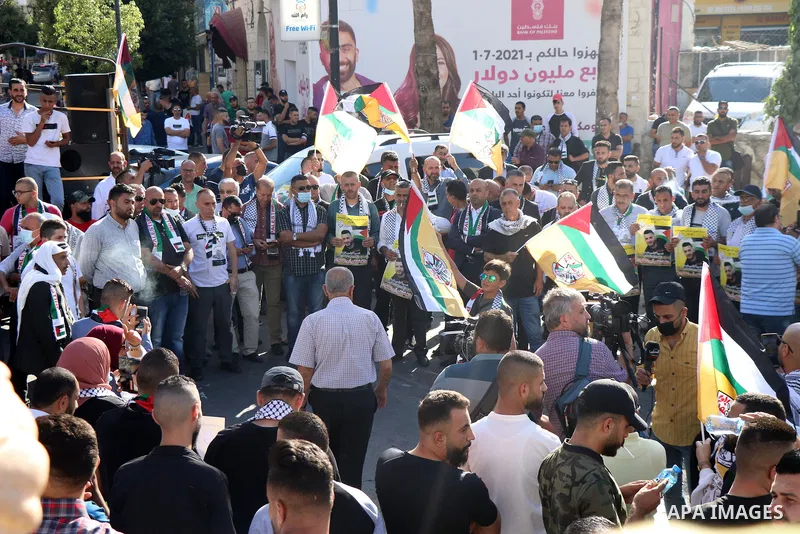 Protesters take part in a protest in solidarity with Palestinian prisoner on hunger strike in Israeli jails, Ghadanfar Abu Utwan, in the West Bank city of Ramallah, on June 27, 2021. Abu Utwan has been on hunger strike f...