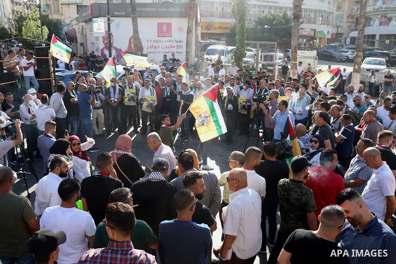Protesters take part in a protest in solidarity with Palestinian prisoner on hunger strike in Israeli jails, Ghadanfar Abu Utwan, in the West Bank city of Ramallah, on June 27, 2021. Abu Utwan has been on hunger strike f...