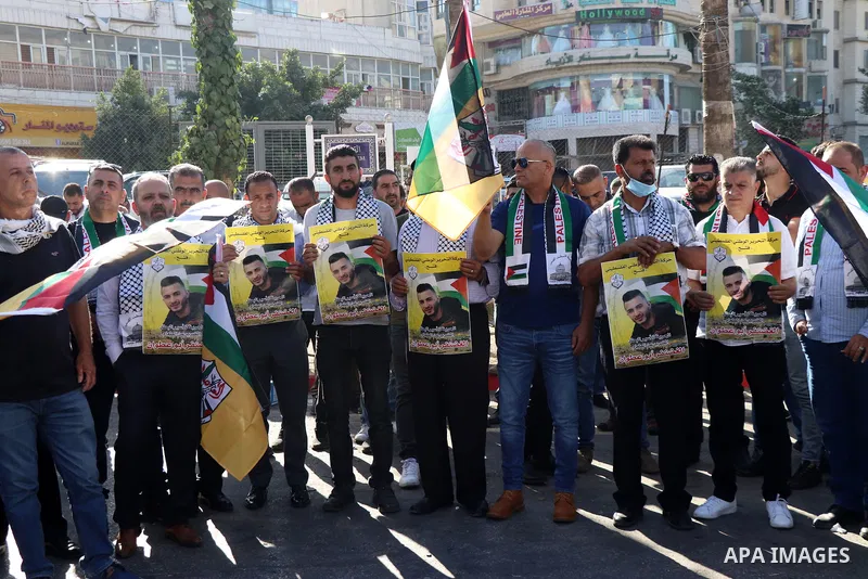Protesters take part in a protest in solidarity with Palestinian prisoner on hunger strike in Israeli jails, Ghadanfar Abu Utwan, in the West Bank city of Ramallah, on June 27, 2021. Abu Utwan has been on hunger strike f...