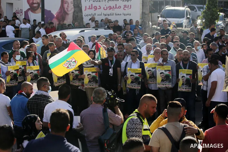 Protesters take part in a protest in solidarity with Palestinian prisoner on hunger strike in Israeli jails, Ghadanfar Abu Utwan, in the West Bank city of Ramallah, on June 27, 2021. Abu Utwan has been on hunger strike f...