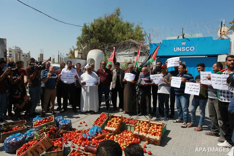 Palestinian farmers and traders take part in a protest against Israeli authorities a new restriction on them in front of the headquarter United Nation "UNSCO", in Gaza city, on June 28, 2021. Israeli authorities have pla...