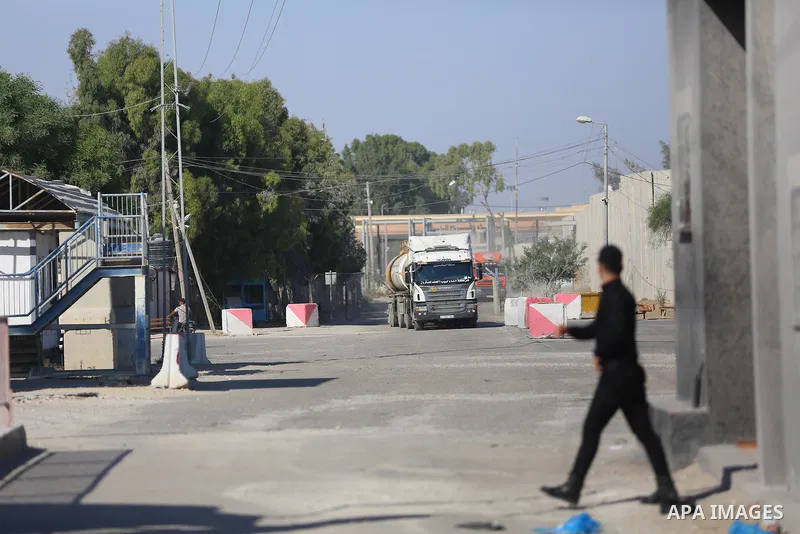 A fuel tanker for Gaza's sole power plant arrives while flying Qatari flags in Rafah in the southern Gaza Strip, on June 28, 2021 Israel allowed fuel tankers funded by Qatar to enter the Gaza Strip via the Kerem Shalom c...