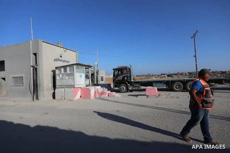 A fuel tanker for Gaza's sole power plant arrives while flying Qatari flags in Rafah in the southern Gaza Strip, on June 28, 2021 Israel allowed fuel tankers funded by Qatar to enter the Gaza Strip via the Kerem Shalom c...