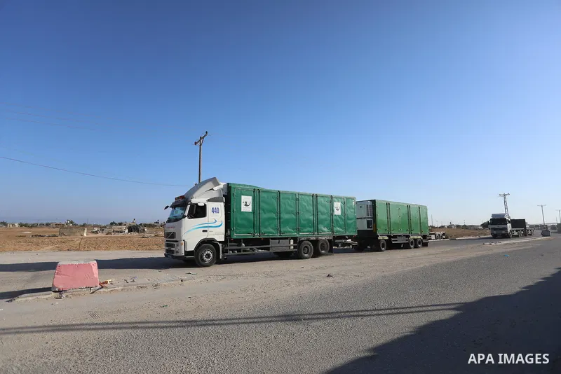 A fuel tanker for Gaza's sole power plant arrives while flying Qatari flags in Rafah in the southern Gaza Strip, on June 28, 2021 Israel allowed fuel tankers funded by Qatar to enter the Gaza Strip via the Kerem Shalom c...