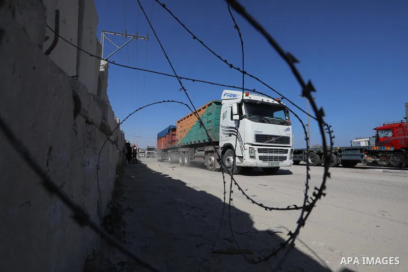 A fuel tanker for Gaza's sole power plant arrives while flying Qatari flags in Rafah in the southern Gaza Strip, on June 28, 2021 Israel allowed fuel tankers funded by Qatar to enter the Gaza Strip via the Kerem Shalom c...