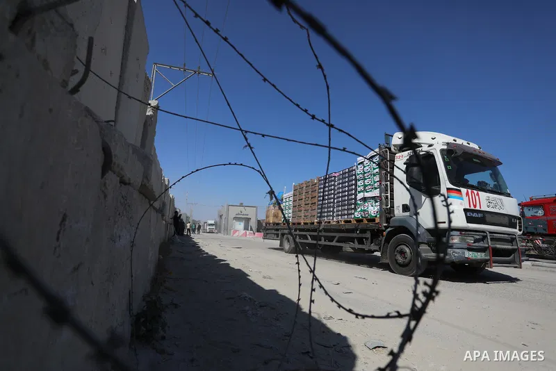 A fuel tanker for Gaza's sole power plant arrives while flying Qatari flags in Rafah in the southern Gaza Strip, on June 28, 2021 Israel allowed fuel tankers funded by Qatar to enter the Gaza Strip via the Kerem Shalom c...