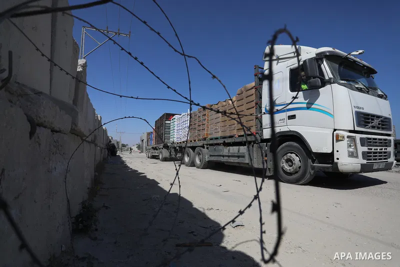 A fuel tanker for Gaza's sole power plant arrives while flying Qatari flags in Rafah in the southern Gaza Strip, on June 28, 2021 Israel allowed fuel tankers funded by Qatar to enter the Gaza Strip via the Kerem Shalom c...
