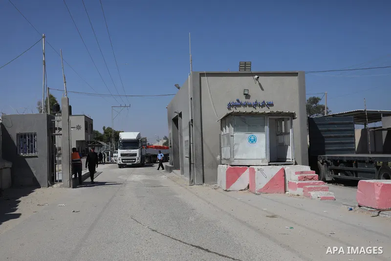 A fuel tanker for Gaza's sole power plant arrives while flying Qatari flags in Rafah in the southern Gaza Strip, on June 28, 2021 Israel allowed fuel tankers funded by Qatar to enter the Gaza Strip via the Kerem Shalom c...