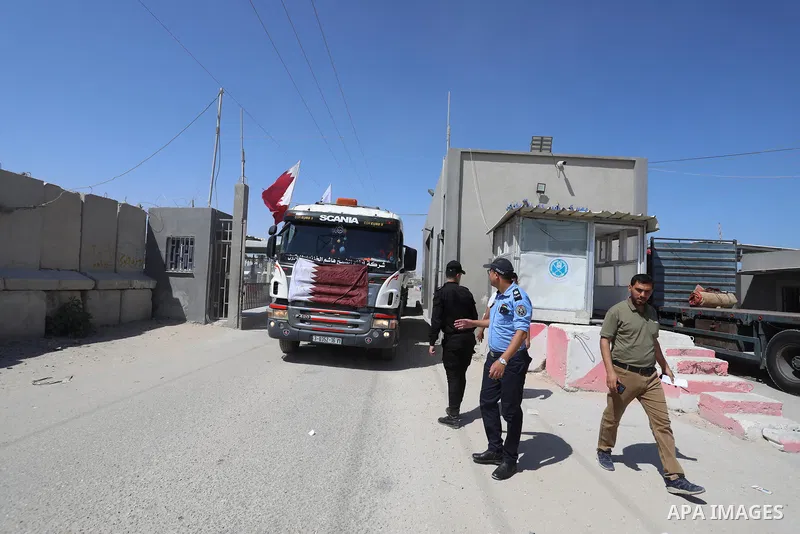 A fuel tanker for Gaza's sole power plant arrives while flying Qatari flags in Rafah in the southern Gaza Strip, on June 28, 2021 Israel allowed fuel tankers funded by Qatar to enter the Gaza Strip via the Kerem Shalom c...