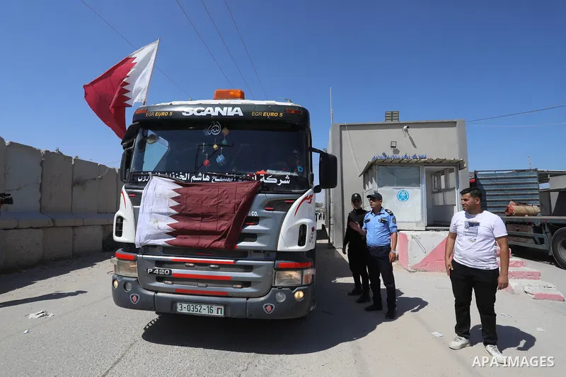 A fuel tanker for Gaza's sole power plant arrives while flying Qatari flags in Rafah in the southern Gaza Strip, on June 28, 2021 Israel allowed fuel tankers funded by Qatar to enter the Gaza Strip via the Kerem Shalom c...