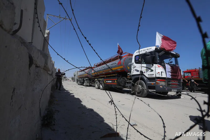 A fuel tanker for Gaza's sole power plant arrives while flying Qatari flags in Rafah in the southern Gaza Strip, on June 28, 2021 Israel allowed fuel tankers funded by Qatar to enter the Gaza Strip via the Kerem Shalom c...