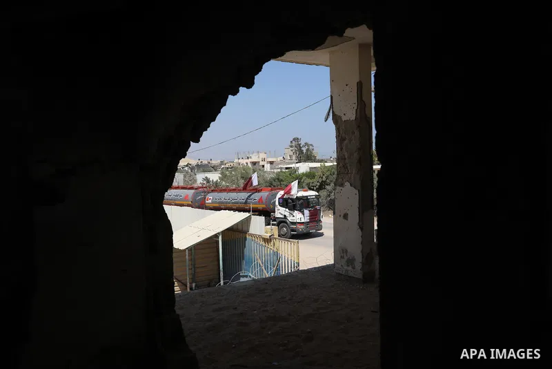 A fuel tanker for Gaza's sole power plant arrives while flying Qatari flags in Rafah in the southern Gaza Strip, on June 28, 2021 Israel allowed fuel tankers funded by Qatar to enter the Gaza Strip via the Kerem Shalom c...