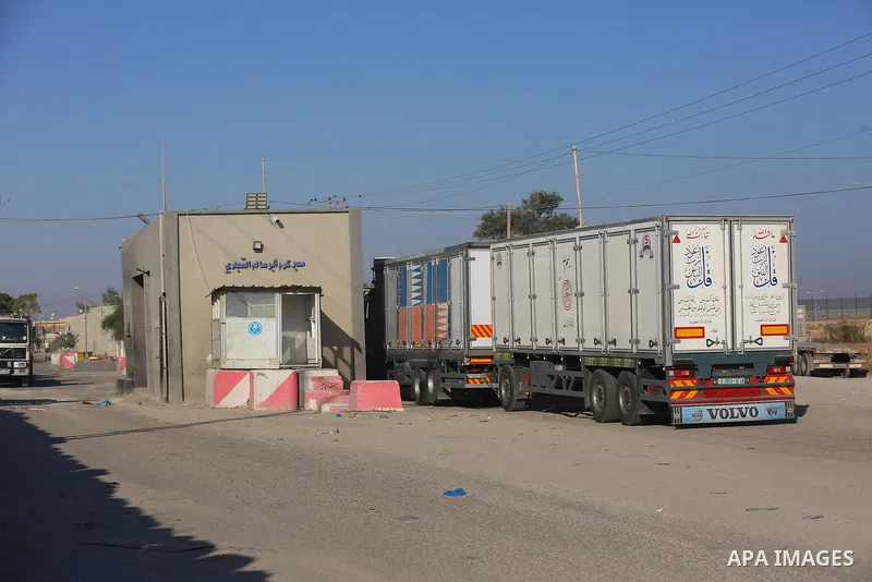 A fuel tanker for Gaza's sole power plant arrives while flying Qatari flags in Rafah in the southern Gaza Strip, on June 28, 2021 Israel allowed fuel tankers funded by Qatar to enter the Gaza Strip via the Kerem Shalom c...