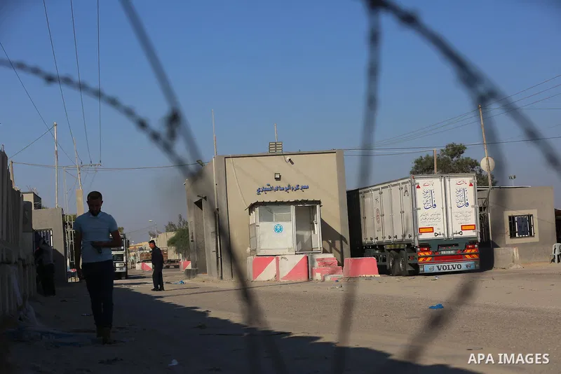 A fuel tanker for Gaza's sole power plant arrives while flying Qatari flags in Rafah in the southern Gaza Strip, on June 28, 2021 Israel allowed fuel tankers funded by Qatar to enter the Gaza Strip via the Kerem Shalom c...