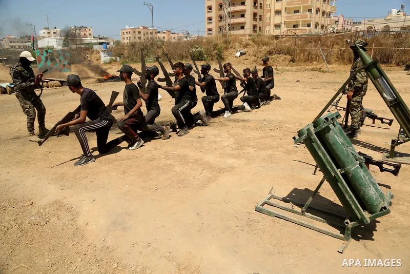 Young Palestinians attend a military summer camp organised by the Islamic Jihad Movement, in Gaza City, June 28, 2021. Photo by Dawoud Abu alkas