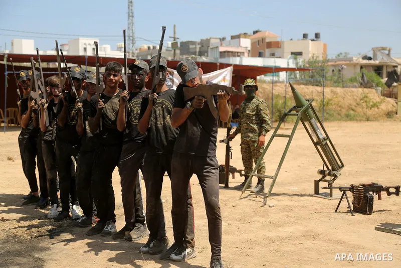 Young Palestinians attend a military summer camp organised by the Islamic Jihad Movement, in Gaza City, June 28, 2021. Photo by Dawoud Abu alkas