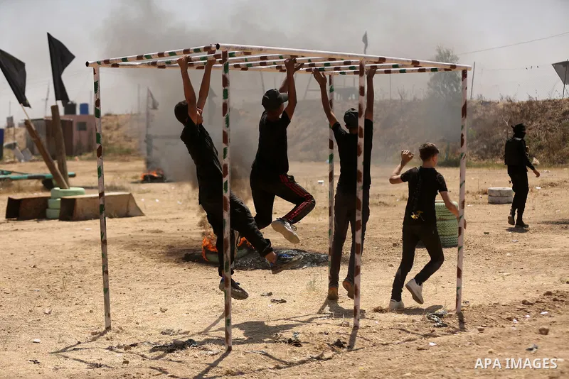 Young Palestinians attend a military summer camp organised by the Islamic Jihad Movement, in Gaza City, June 28, 2021. Photo by Dawoud Abu alkas