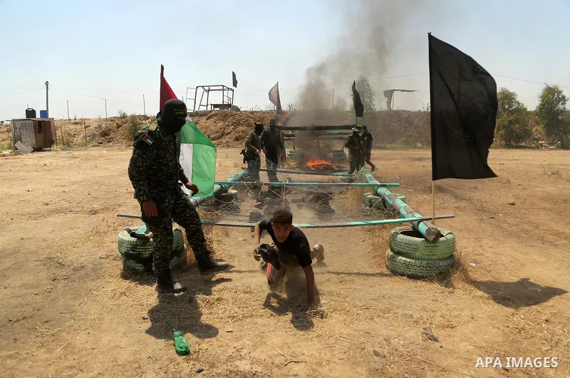 Young Palestinians attend a military summer camp organised by the Islamic Jihad Movement, in Gaza City, June 28, 2021. Photo by Dawoud Abu alkas