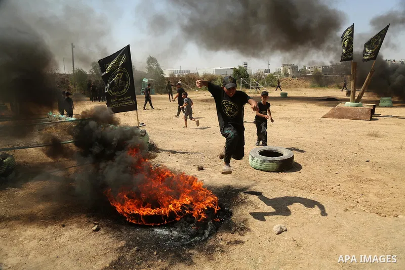 Young Palestinians attend a military summer camp organised by the Islamic Jihad Movement, in Gaza City, June 28, 2021. Photo by Dawoud Abu alkas