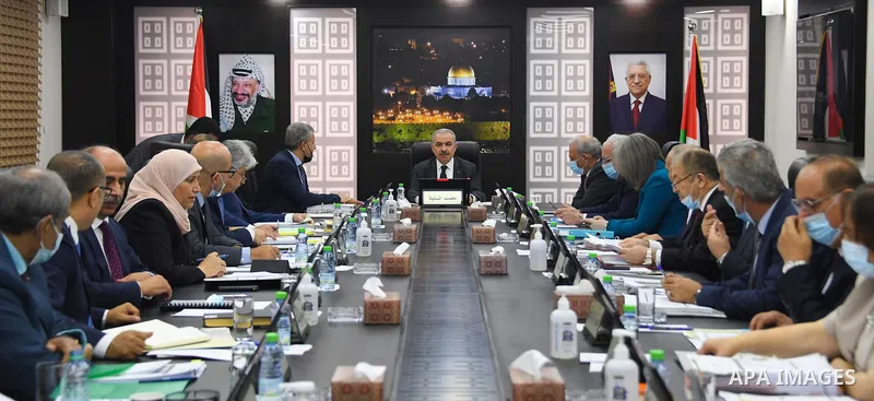 Palestinian Prime Minister Mohammad Ishtayeh, chairs the weekly meeting of his government, in the West Bank city of Ramallah on June 28, 2021. Photo by Prime Minister Office