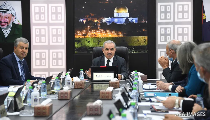 Palestinian Prime Minister Mohammad Ishtayeh, chairs the weekly meeting of his government, in the West Bank city of Ramallah on June 28, 2021. Photo by Prime Minister Office