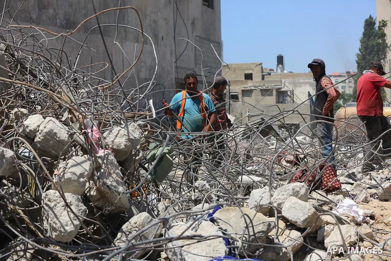 Palestinian engineer Ahmed Al-Qiq, 30, inspects damage at his center for the Training and Development, which was destroyed by Israeli air strikes during the May 2021 conflict between Hamas and Israel, in Gaza city, on Ju...