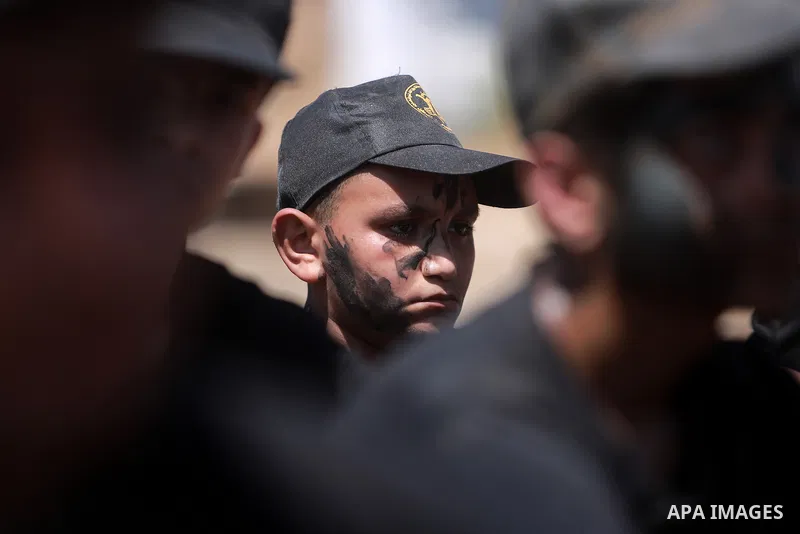 Young Palestinians attend a military summer camp organised by the Islamic Jihad Movement, in Gaza City, June 29, 2021. Photo by Mohammed Dahman Young Palestinians attend a military summer camp organised by the Islamic Ji...