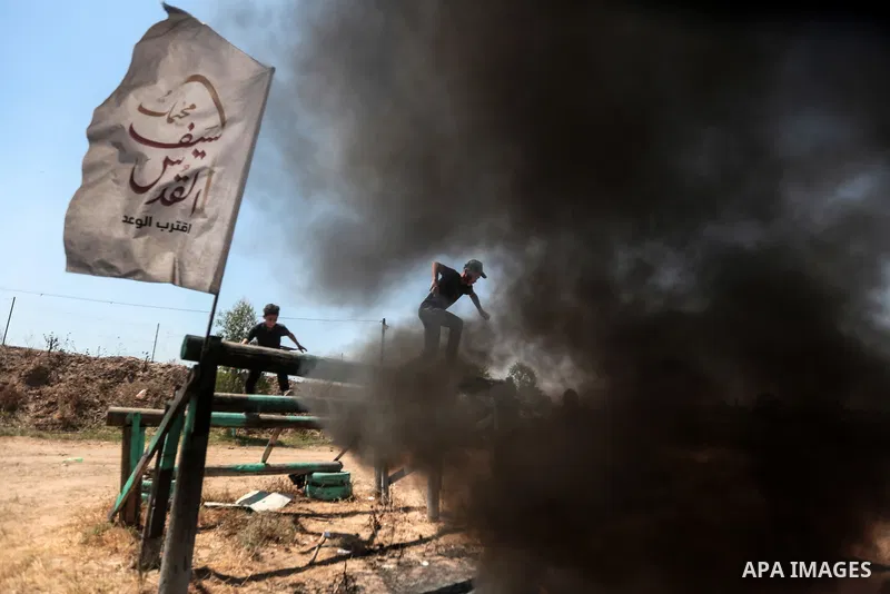 Young Palestinians attend a military summer camp organised by the Islamic Jihad Movement, in Gaza City, June 29, 2021. Photo by Mohammed Dahman Young Palestinians attend a military summer camp organised by the Islamic Ji...