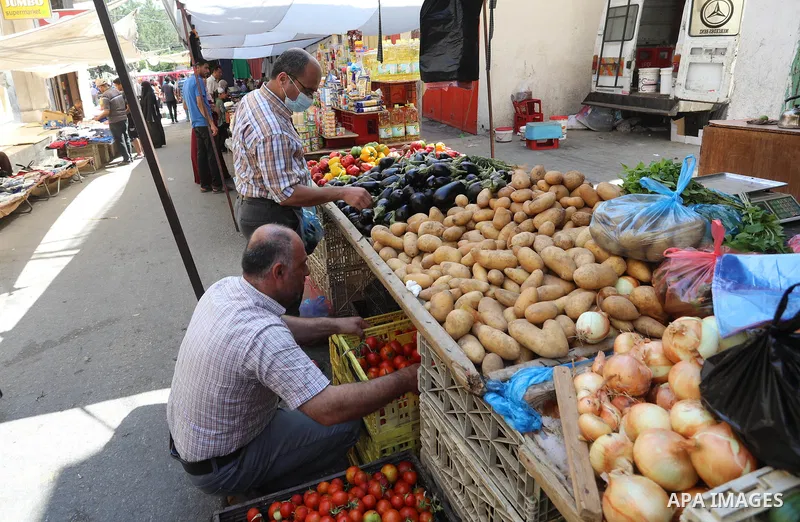 . Photo by Ashraf Amra Palestinians shop at a weekly market in Deir al-Balah in the center of Gaza Strip on June 29, 2021. The authorities in Gaza Strip decided to reopen the popular markets, after its closure, due to th...