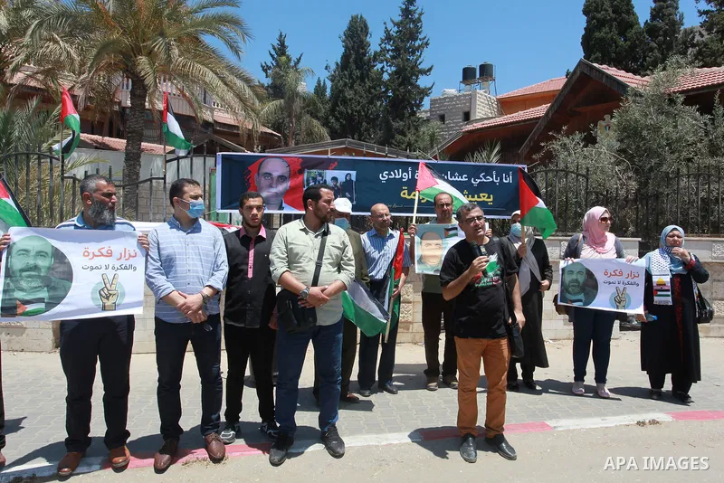Palestinians take part during a protest against the death of Palestinian human rights activist Nizar Banat in Gaza City on June 29, 2021, days after he died during following arrested by Palestinian Authority security for...