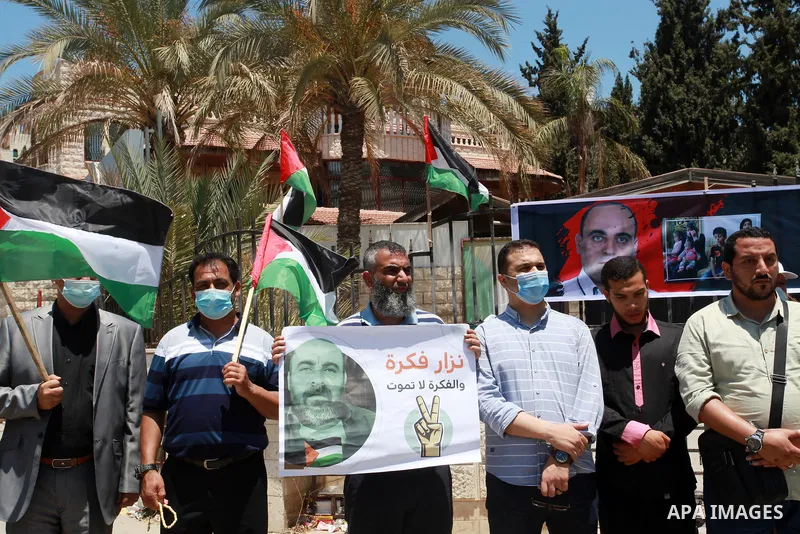 Palestinians take part during a protest against the death of Palestinian human rights activist Nizar Banat in Gaza City on June 29, 2021, days after he died during following arrested by Palestinian Authority security for...