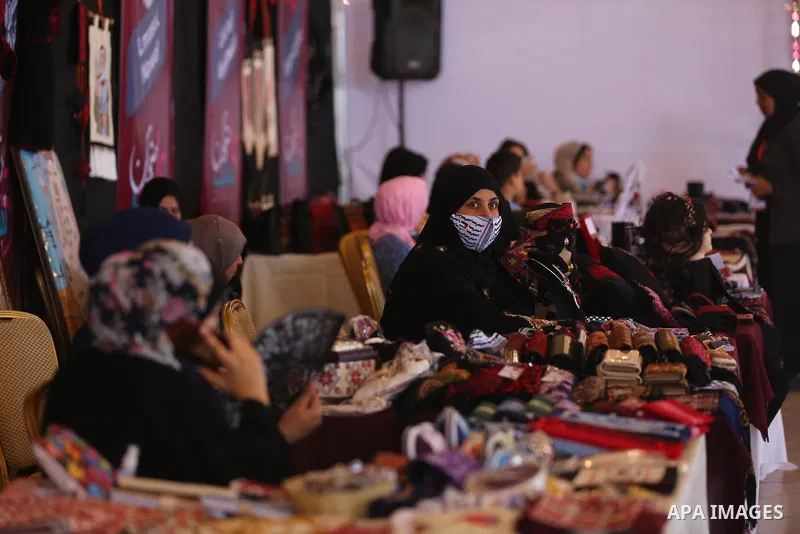 Palestinians attend the opening of the 15th annual exhibition entitled "Women’s Products" in Gaza City, on June 29, 2021. Photo by Ashraf Amra