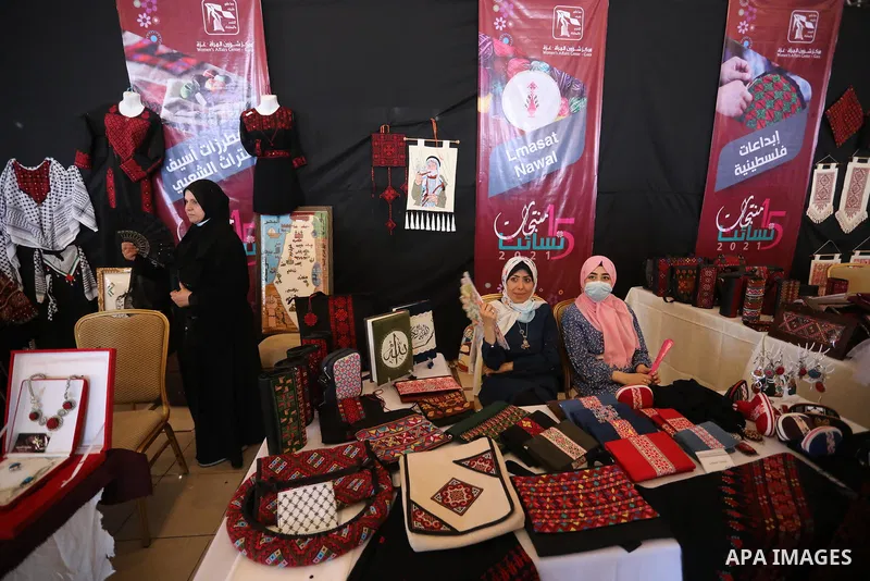 Palestinians attend the opening of the 15th annual exhibition entitled "Women’s Products" in Gaza City, on June 29, 2021. Photo by Ashraf Amra