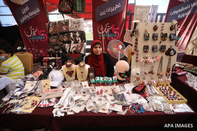 Palestinians attend the opening of the 15th annual exhibition entitled "Women’s Products" in Gaza City, on June 29, 2021. Photo by Ashraf Amra