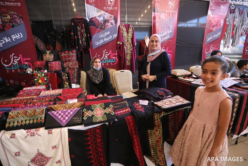 Palestinians attend the opening of the 15th annual exhibition entitled "Women’s Products" in Gaza City, on June 29, 2021. Photo by Ashraf Amra