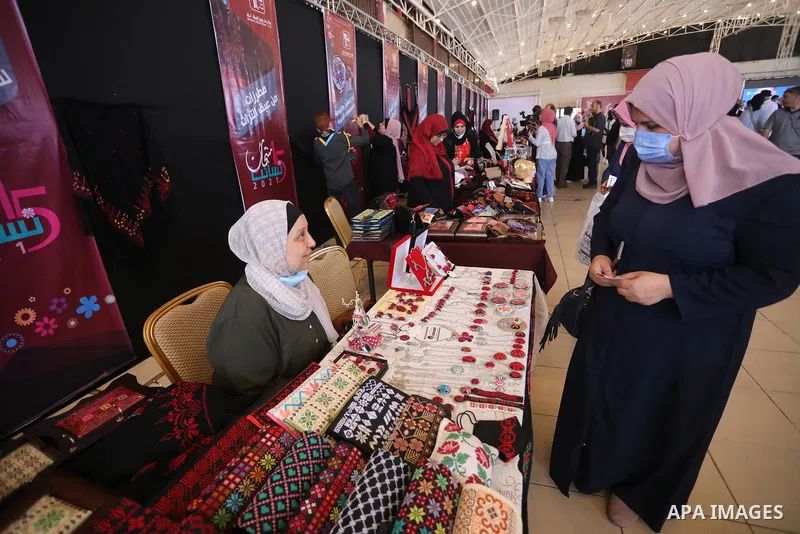 Palestinians attend the opening of the 15th annual exhibition entitled "Women’s Products" in Gaza City, on June 29, 2021. Photo by Ashraf Amra