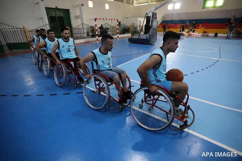 Disabled Palestinian men on wheelchairs participate in Super Wheelchair Basketball League in Gaza city, on June 29, 2021. The Super League wheelchair basketball matches are back after a year and a half break due to the C...