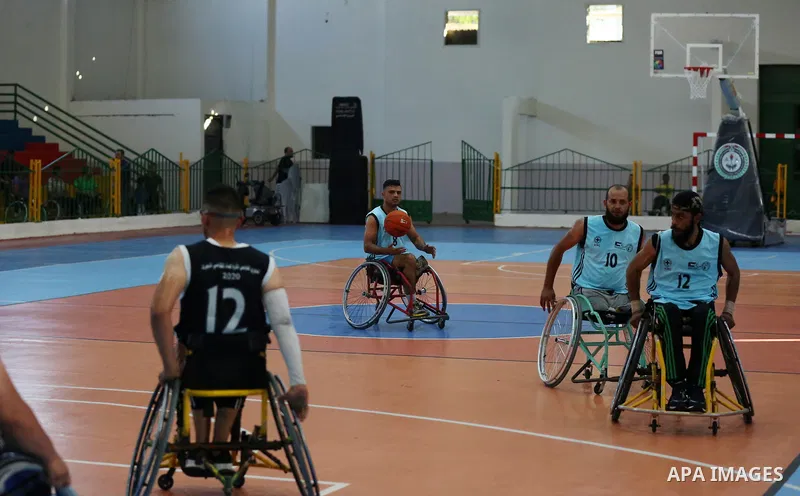 Disabled Palestinian men on wheelchairs participate in Super Wheelchair Basketball League in Gaza city, on June 29, 2021. The Super League wheelchair basketball matches are back after a year and a half break due to the C...
