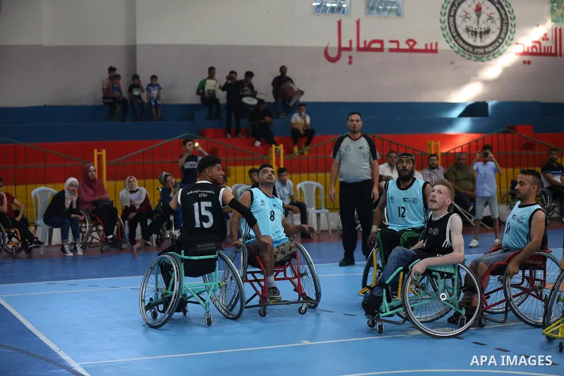Disabled Palestinian men on wheelchairs participate in Super Wheelchair Basketball League in Gaza city, on June 29, 2021. The Super League wheelchair basketball matches are back after a year and a half break due to the C...