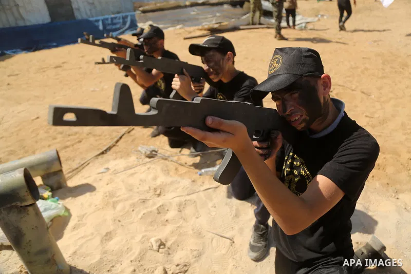 Young Palestinians take part in a graduation ceremony at a military summer camp organised by the Islamic Jihad Movement, in Gaza City June 30, 2021. Photo by Dawoud Abu alkas
