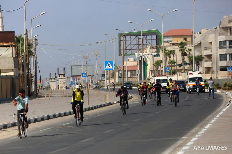 Palestinians take part in a bike race championship including disabled people, in Gaza city, on June 30, 2021. Photo by Ashraf Amra