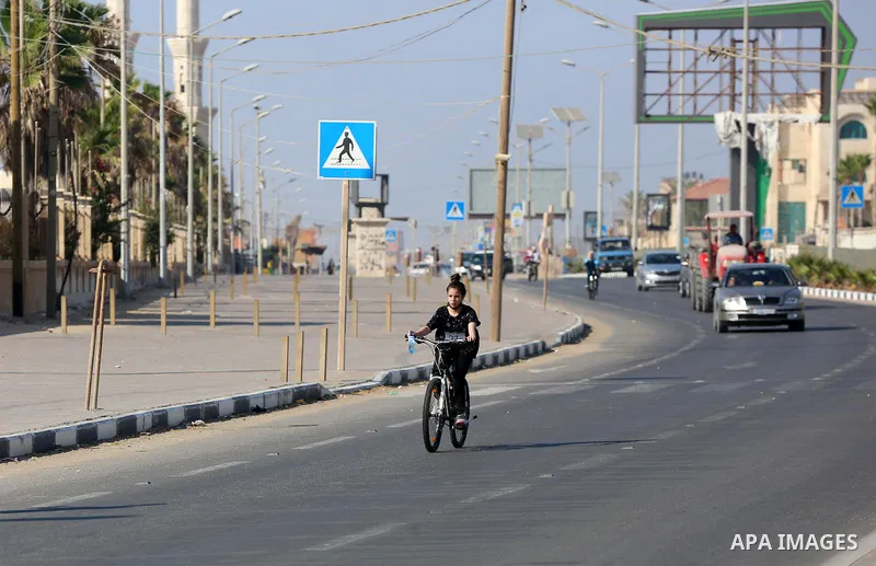 Palestinians take part in a bike race championship including disabled people, in Gaza city, on June 30, 2021. Photo by Ashraf Amra
